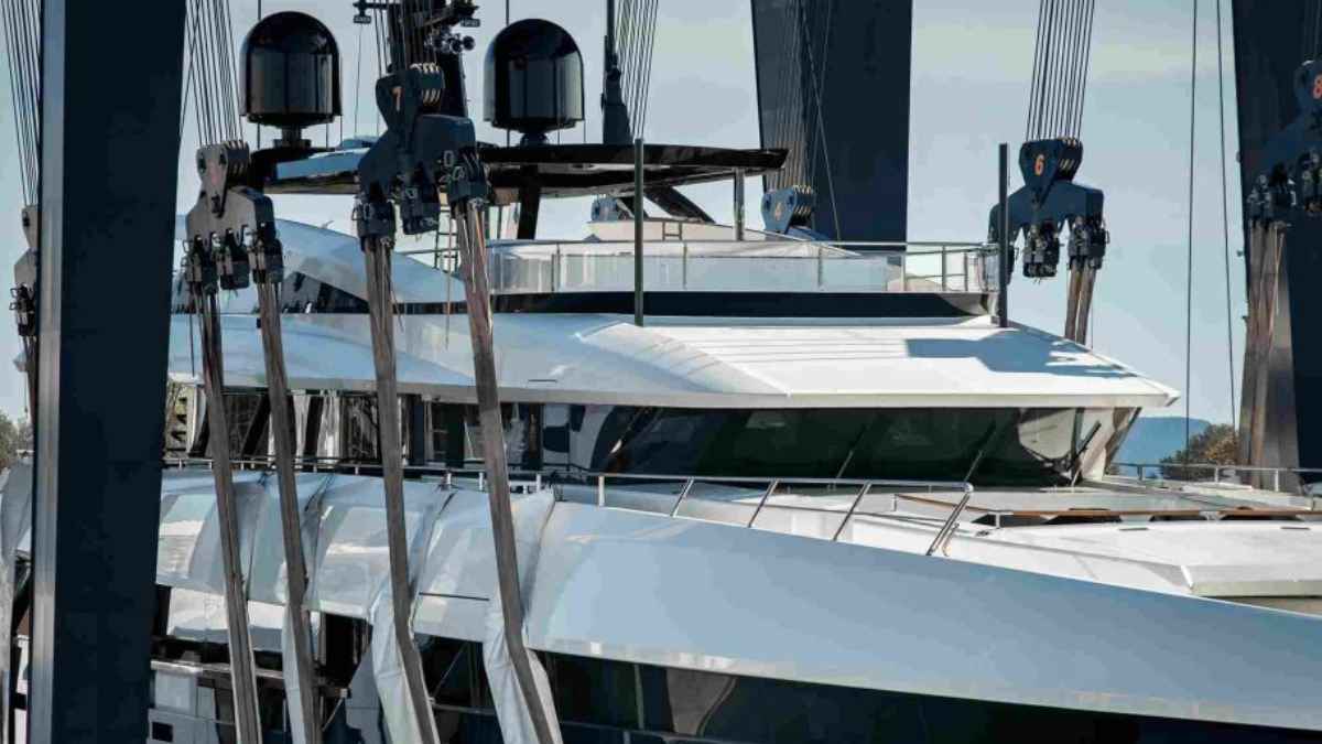 Superyacht being held by marine hoist