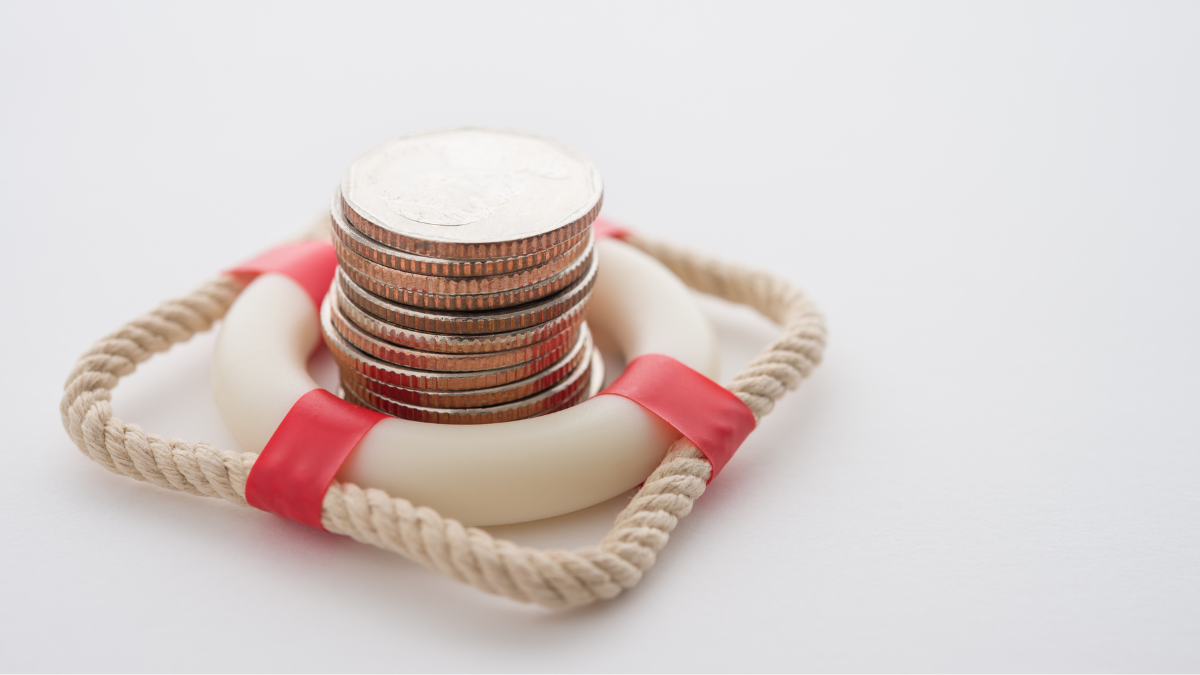 Pile of coins inside miniature life preserver